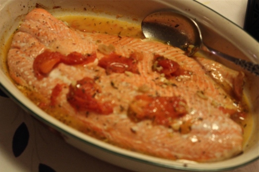Serve salmon with tomato sauce spooned over the top.
