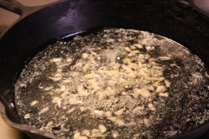 Saute garlic in butter and olive oil.