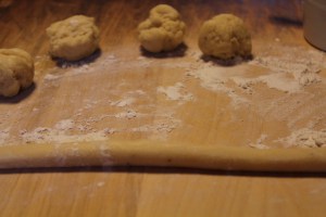 Roll small balls of dough into ropes either 5 inches or 8 inches long.