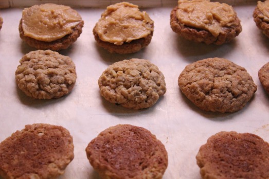 Match up cookies in pairs.  Spread filling on the bottom of one and top with the other.