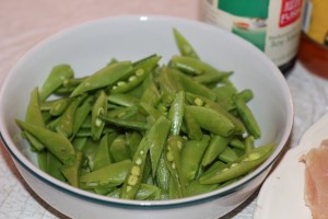 Snow peas, trimmed and cut diagonally lengthwise .