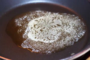 Hot skillet with butter melted.