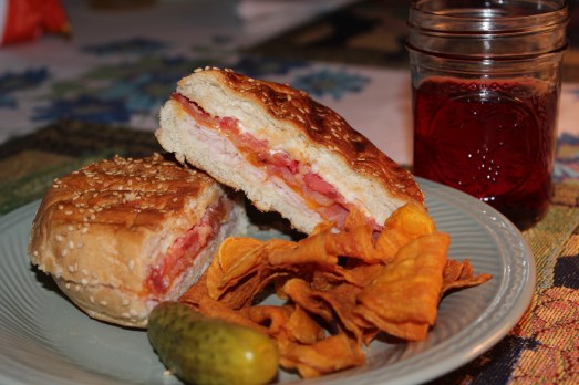  Grilled turkey, bacon, cheese and tomato panini.