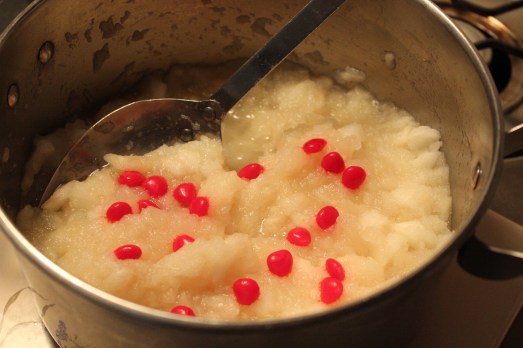Add cinnamon candies to hot sauce.