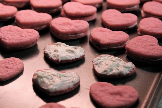 Making the sandwiches with cream filling.