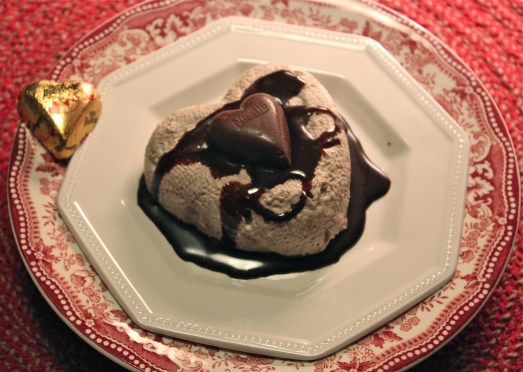 Unmold heart onto a puddle of chocolate sauce, and drizzle with more chocolate.