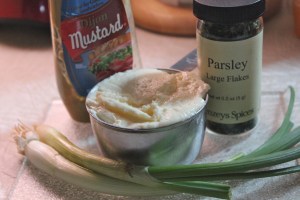 Make the dressing with mayo, mustard, parsley and green onions.