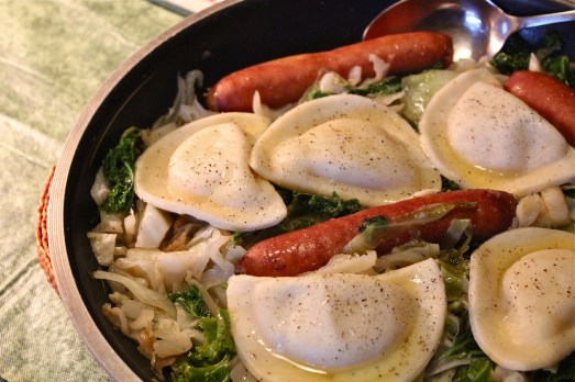 Sauted cabbage, cheddarwurst and pierogies.