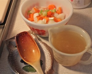 Chopped veggies and chicken stock waiting their turn in the pot.