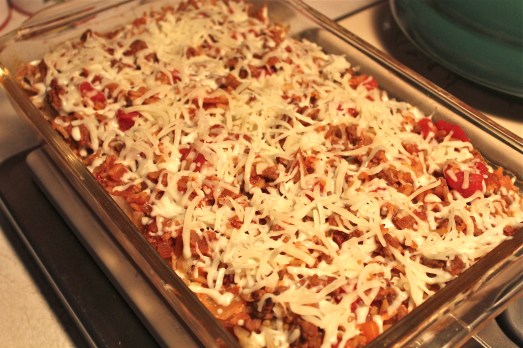 Cover with grated cheese and bake until melted . 