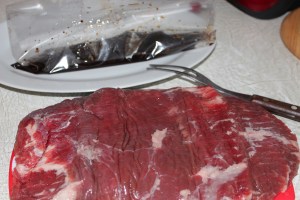 Marinate the flank steak in a zip-top bag.