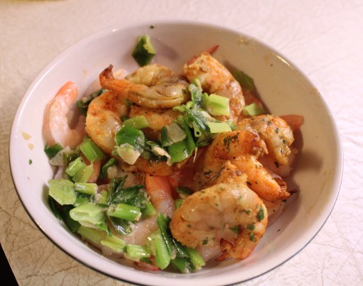 Precook the shrimp and scallions and set aside.