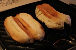 buns toasting on the griddle