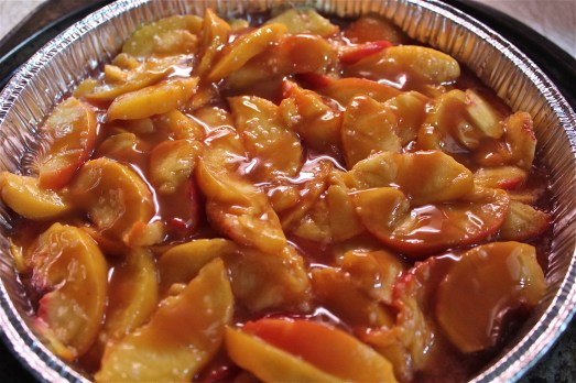 Pour caramel topping over the peaches.