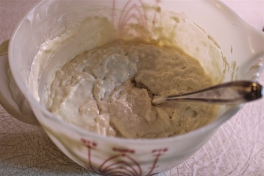 Air bubbles start to form when the baking soda reacts with the yogurt.