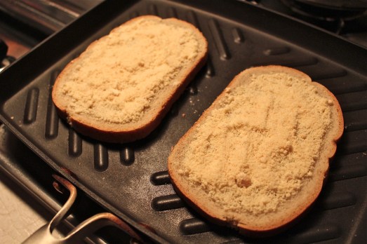 First layer of cheese is grated Parmesan.