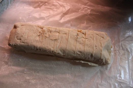 Make filling, roll into a log and chill it.