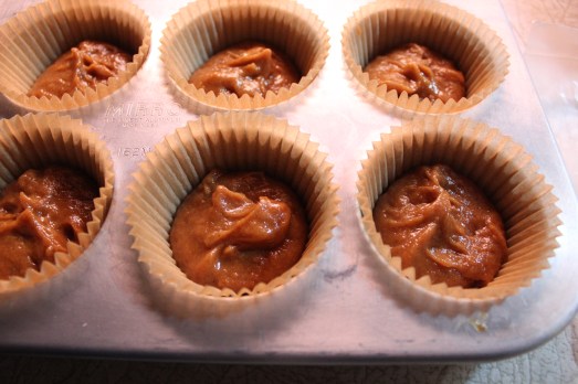 A little batter in the bottom of each cup.