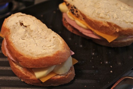 Butter the outside of bread on both sides and grill it.