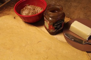 Butter, pumpkin butter, and sugar-spice mixture ready to spread on the dough.
