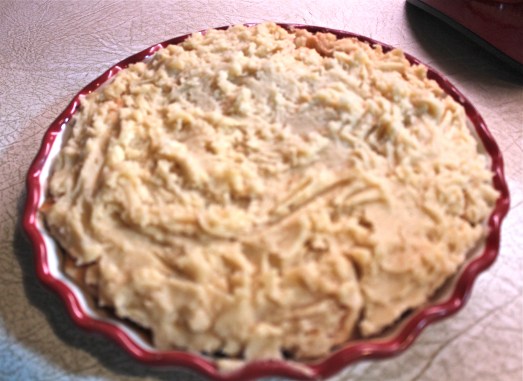 Spread dough out to cover apples as much as you can.