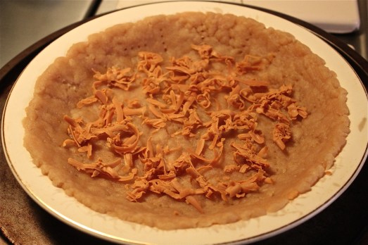 Sprinkle 1/3 of cheese in the bottom of crust.