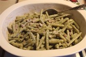 Green beans coated with sauce.