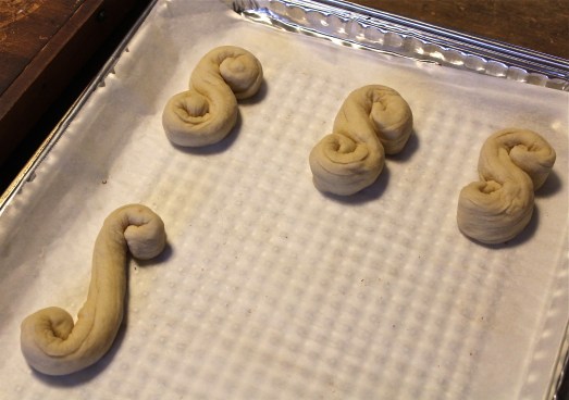 Form the ropes of dough into spiral shapes.