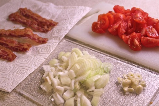 Bacon crisped, tomatoes, onions and garlic chopped and pan ready.