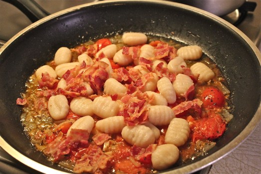 Once gnocchi are cooked, add to sauce with bacon.