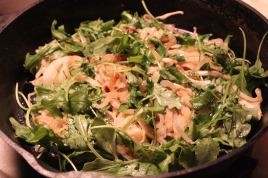 Next add the arugula and stir a bit till it wilts.