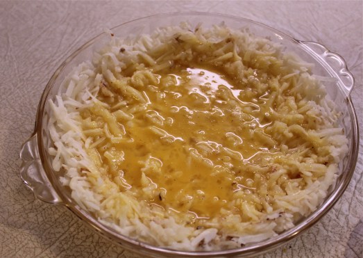 Pour the egg mixture over the potatoes.