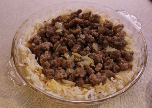 Layer on the sausage and onions.