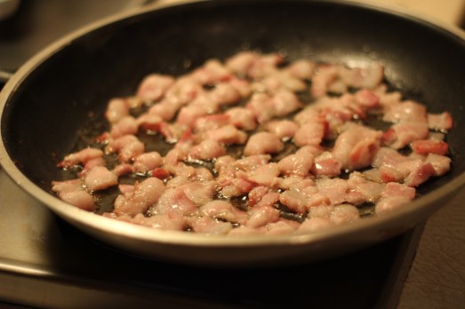 Cooking up the bacon.