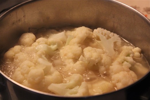 Cook the cauliflower in the chicken broth.