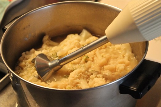 Puree the cooked cauliflower with a blender.