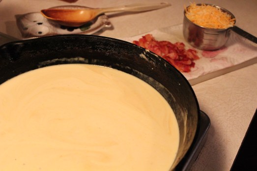 Making the cheese sauce with Alfredo sauce.