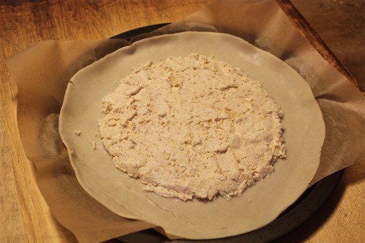 Spread ricotta filling on dough leaving a border.