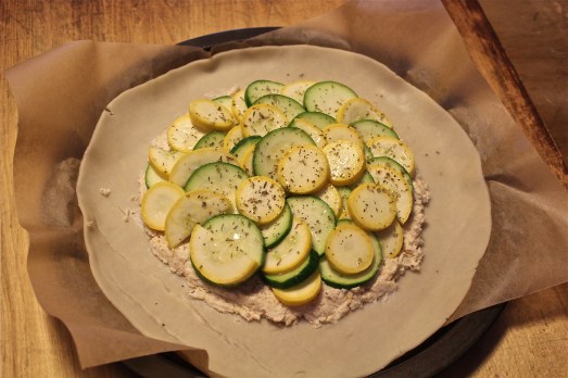 Top with squash slices and seasonings.