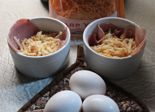 Pour some hash browns over the ham.