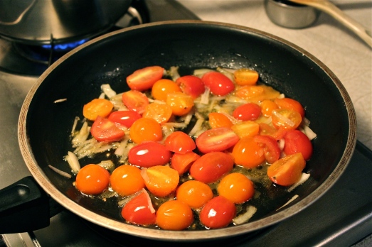 Saute the shallots and tomatoes till they soften.