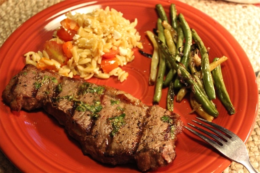 Grilled steak and green  beans with orzo mixture.