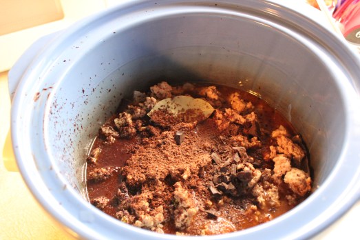 Grated chocolate and sweet spices are added to the mixture.