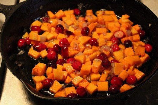 Add b-nut squash, cranberries, maple syrup and water.