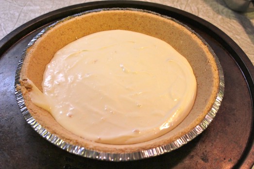 Plain cheesecake batter goes in the bottom of the crust.