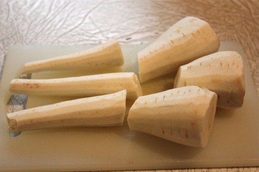 Cut the narrow end from the thick end, then quarter the thick end.